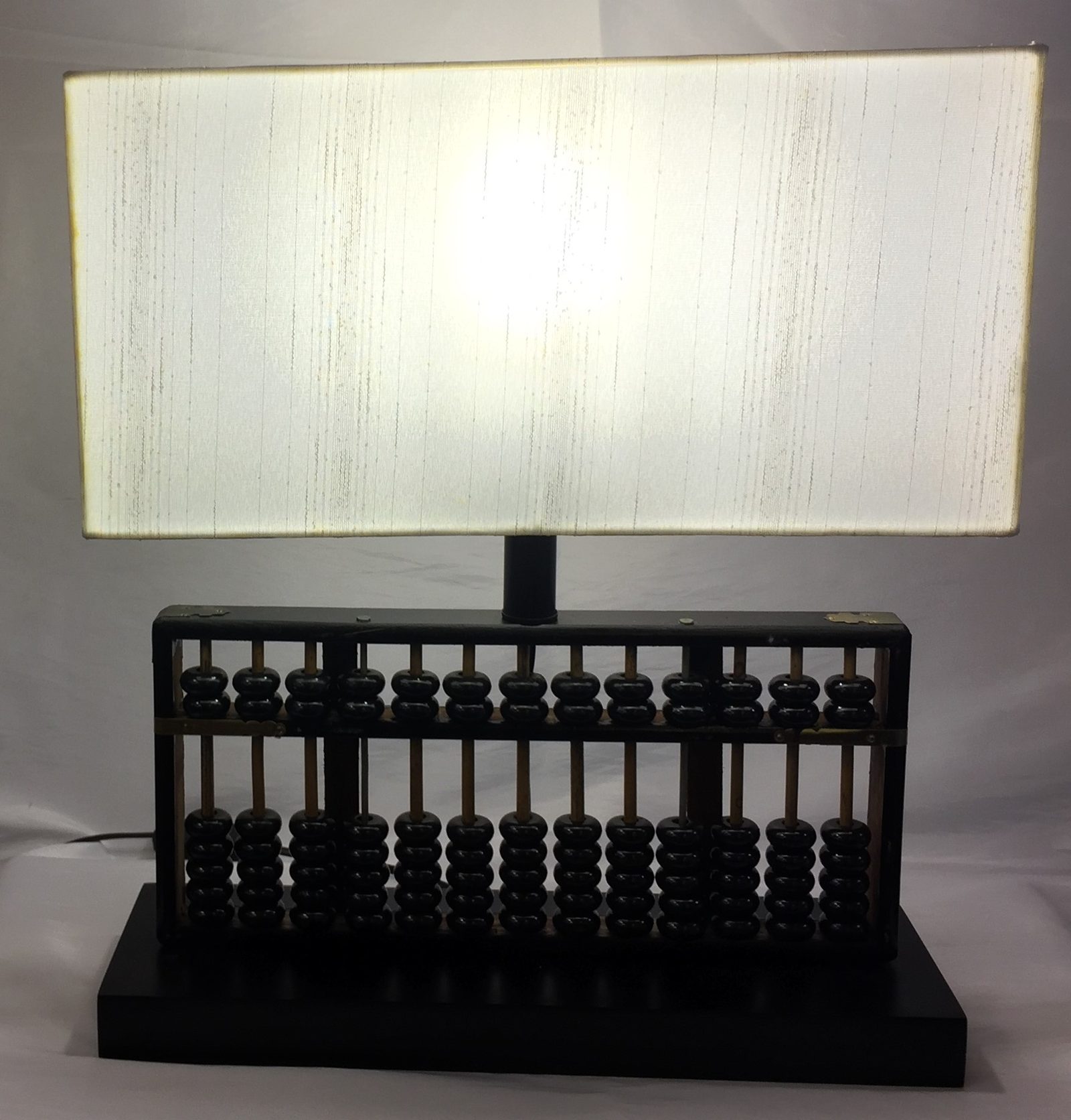 Custom lamp built from an antique wooden abacus