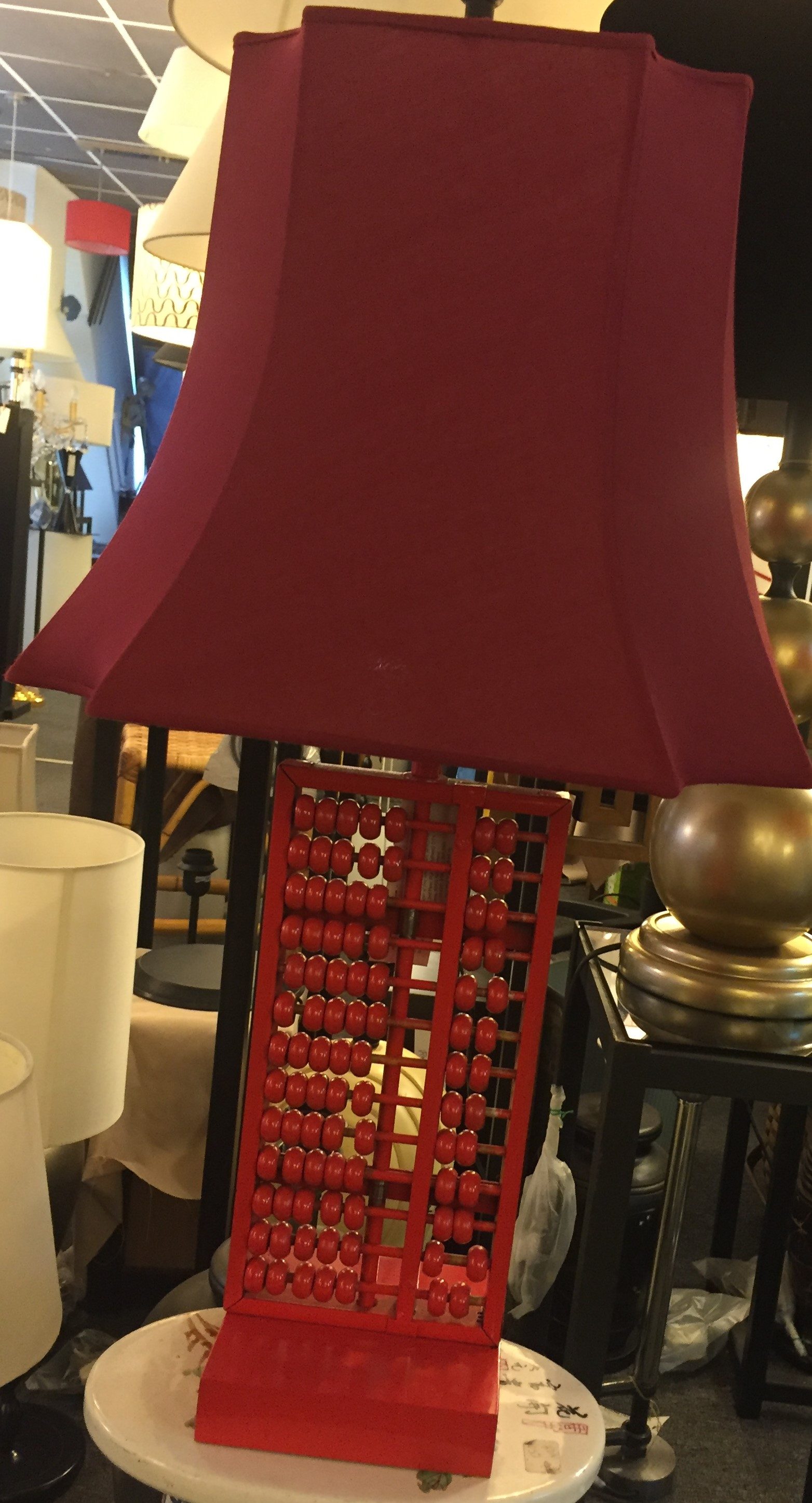 Table lamp with a hand-painted red abacus base