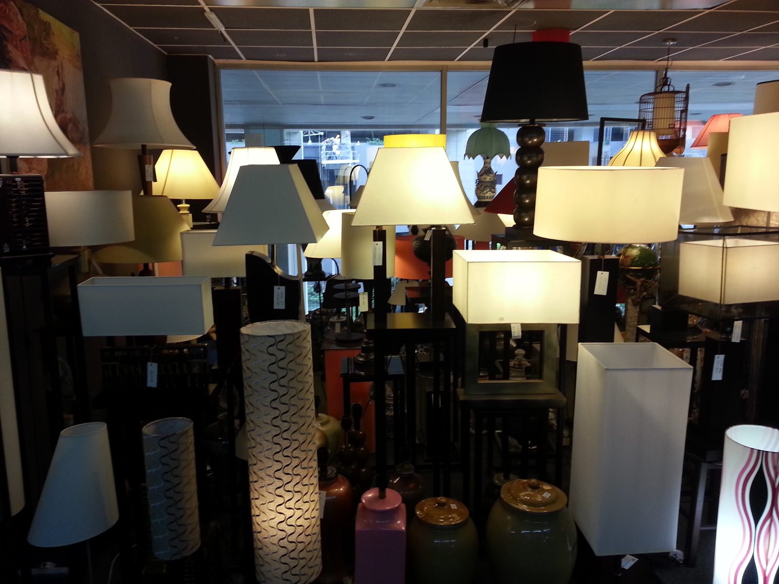 Rows of handmade lampshades lit up inside the Citizone showroom